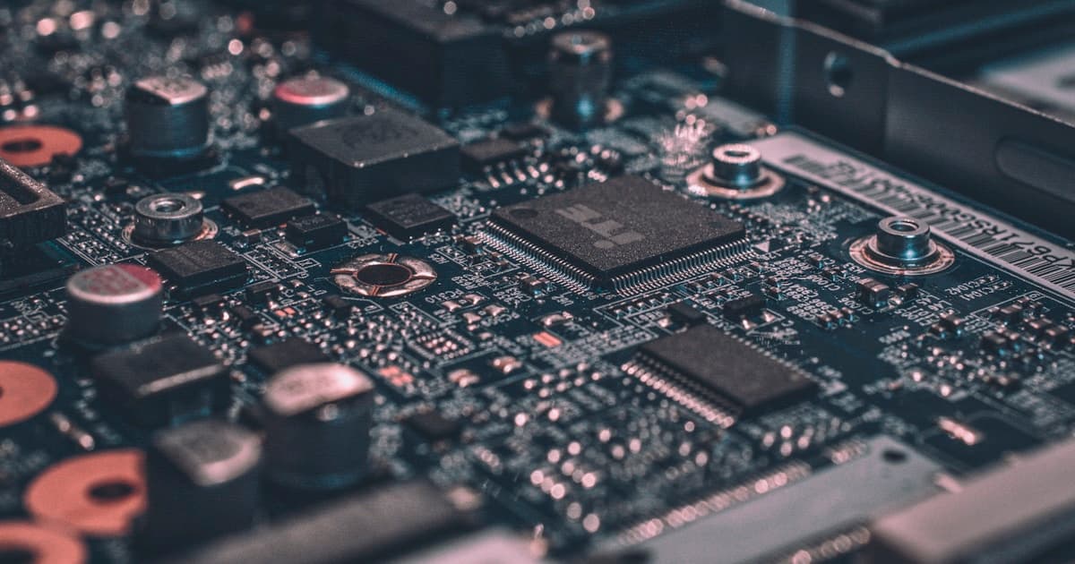 Close-up photograph of chips and components on a laptop circuit board