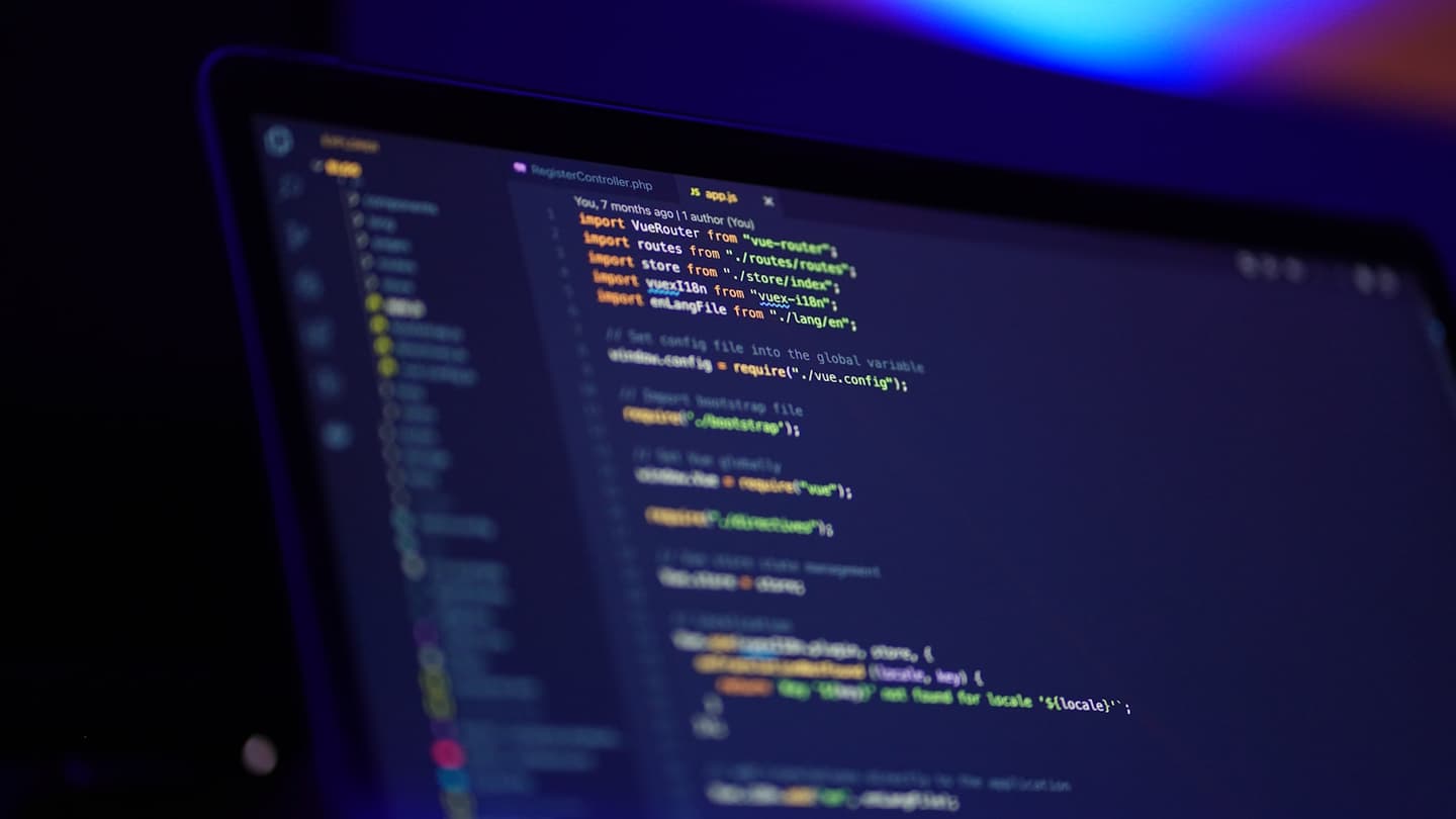 Laptop screen showing source code, illustrating the Kimi K2.7 Code programming model